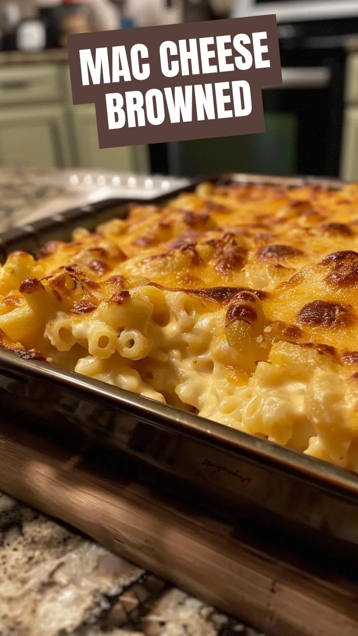 A bubbling dish of baked mac and cheese with a golden crust.