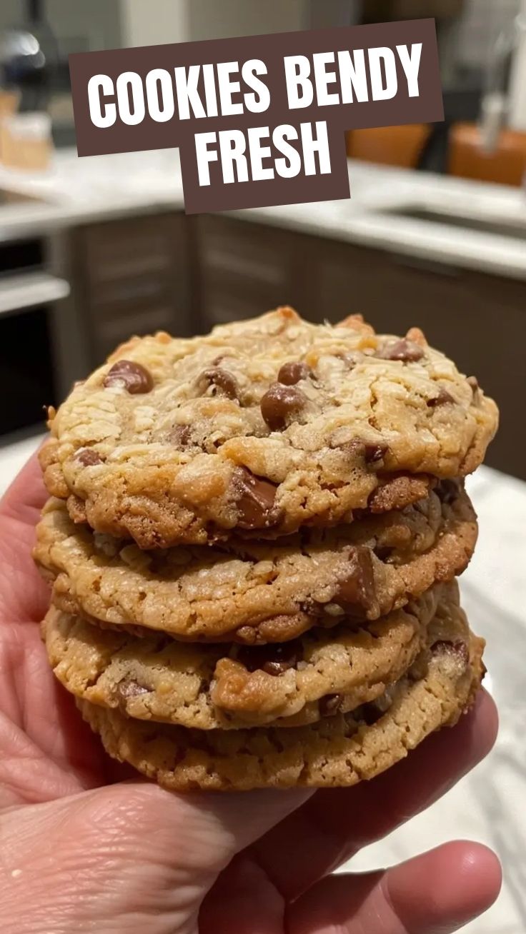 A pile of best chewy cookies freshly baked on a cooling rack.