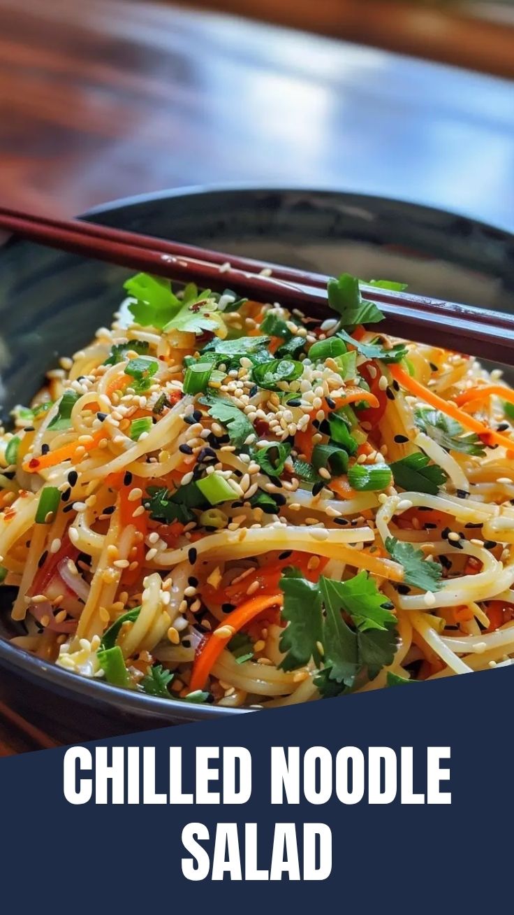 A vibrant cold noodle salad, Asian-style, with fresh vegetables and sesame seeds.
