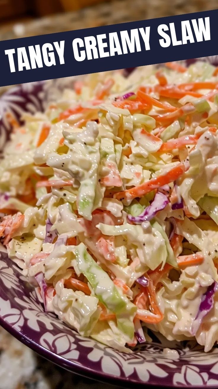 A bowl of delicious creamy coleslaw with shredded cabbage and carrots.